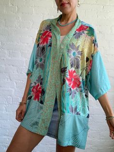 this is colorful free size shirt made of vintage silk material It is one of a kind, patchwork design with floral prints inspired by boho hippy style perfect over all for men and ladies one size, loose, oversized style, with wide kimono sleeves more available at https://www.etsy.com/shop/AltheaStores? Thank you for looking Vintage Floral Print Kimono For Festival, Vintage Floral Print Festival Kimono, Green Floral Print Kimono For Festival, Vintage Patchwork Kimono For Festivals, Vintage Green Kimono For Festival, Green Vintage Kimono For Festival, Summer Vintage Silk Kimono, Vintage Silk Kimono For Summer, Green Bohemian Short Sleeve Kimono