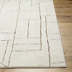 a white rug with lines on the floor