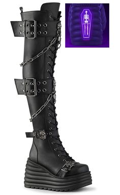 Get ready to dominate the room with the MORTE-215s! These thigh highs boots feature grommet buckle straps and metal skull knockers, be the badass that you are. 4 1/2" (114mm) Wedge Platform Lace-Up Front Thigh-High Boot Featuring 2 Double Grommet Buckle Straps with Metal Skull Knockers at Center and 2 Lower Skull Buckle Straps Skull Knockers on the Outer Heel & Toe Hanging Chain Detail Blacklight Reflective Back Coffin Inside Metal Zip Closure US women's sizing-refer to size chart for more info. Gothic Boots, Leather Thigh High Boots, Metal Skull, Black Vegan, Knee High Leather Boots, Thigh High Boots, Platform Wedges, Thigh High, Thigh Highs