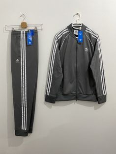 Jacket: Regular fit Ribbed collar 60% recycled polyester, 40% cotton interlock Heavyweight fabric Classic adidas track jacket Front zip pockets Ribbed cuffs and hem Pants: Slim fit Elastic waist with drawcord 60% recycled polyester, 40% cotton interlock Heavyweight fabric Tapered track pants Front zip pockets Ribbed cuffs Tapered legs Please check before you buy: *** Please make sure your address is correct.  I Will charge extra shipping if package is refused or non-deliverable*** Please be happy to send me any question you have: about the shipping options, discounts etc. Shipping Delays in standard and economy shipping may occur duo to lack of flights. Please understand. Import duties, custom fees, taxes and VAT charges are the buyer's responsibility. For USA buyers:  If you choose Standa Classic Adidas, Adidas Tracksuit, Hem Pants, Adidas Track Jacket, Mens Casual Dress Outfits, Adidas Track, How To Hem Pants, Mens Casual Dress, Mens Casual