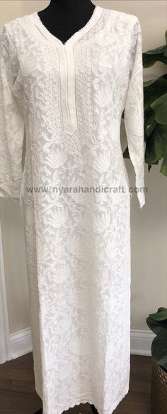 "Classic White Lucknow Chikankari kurta ! Heavy all over hand embroidery (front, back and sleeves) on a fine georgette. Excellent craftsmanship! Includes a white liner Kurta Length-49 inches \"Embroidery designs vary \"" Designer Lace Kurta With Chikankari Embroidery, Embroidered Lace Kurta For Wedding, Wedding Lace Embroidered Kurta, Embroidered Anarkali Lace Kurta, Anarkali Embroidered Lace Kurta, Designer Long Sleeve Kurta With Lace Work, Anarkali Lace Kurta With Embroidery, Embroidered Lace Anarkali Kurta, White Embroidered Lace Kurta