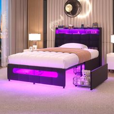 a bedroom with a bed, night stand and purple lights on the headboard is lit up