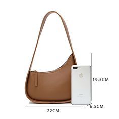 This small genuine leather shoulder bag, known for its trendy half moon design, boasts a two-layer cowhide material and a practical zipper opening. Additionally, it features a wide shoulder strap, a soft handle for comfortable carrying, and a three-dimensional outer bag design. The leather's oil side processing adds a touch of medium hardness to the bag, making it a must-have for any stylish woman.