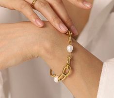 Gold plated mother of pearls bracelet. Beautifully made with 2 inch extender. Gold Pearl Bracelet With Adjustable Chain, Gold Pearl Charm Chain Bracelet, Gold Pearl Bracelet With Metal Charm, Gold Metal Pearl Bracelet With Pearl Charm, Gold Plated Pearl Chain Bracelet, Adjustable Gold Pearl Drop Bracelet, Gold Pearl Bracelets With Adjustable Chain, Metal Pearl Bracelet With Pearl Charm, Gold Pearl Chain Bracelet Gift