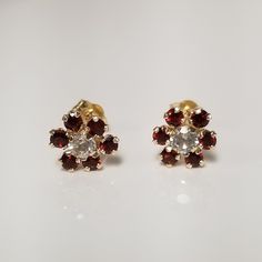 "Thanks for shopping our vintage estate store. We tend to sell well below wholesale and truly hope you enjoy all of our items. Many of the items are one of a kind, so please enjoy scrolling through the pictures and hopefully something will catch your eye. Brown spots are from camera. Nice estate 14k yellow gold .20ct Garnet white topaz flower earrings studs. New studs, came from jewelry store that was closing. Size: 7mm 1/4\" Weight: .71 gram Marked 14k." Birthday Daughter, Brown Spots, Studs Earrings, Earrings Studs, Flower Earrings Studs, White Topaz, Earring Backs, Jewelry Store, Flower Earrings