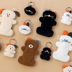 a group of stuffed animal key chains sitting on top of a table