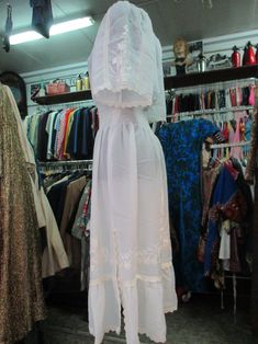 "Wonderful 70s white Romanian dress. Sheer fabric. It features traditional embroidery on chest, sleeves and skirt. Smocking neckline and elasticated waistband (pics 2-3). Beautiful raglan cup sleeves (pic.5). Skirt lesftside rip (pic.7). It is refined all around (neckline, sleeve-ends, rip and hem) with crochet pattern. It can be a wedding dress. It's a very beautiful dress. Mint conditions. It fits size S-M Measurements: (lay flat and double chest and waist) Shoulders 14.2\"-15.7\" chest 32.2\" White Bohemian Dress With Smocked Bodice, Vintage White Flowy Maxi Dress, White Flowy Vintage Maxi Dress, Vintage Lace Trim Maxi Dress For Beach, Vintage Beach Maxi Dress With Lace Trim, Vintage White Maxi Dress With Short Sleeves, White Vintage Maxi Dress With Short Sleeves, Bohemian Vintage White Dress For Summer, Summer Bohemian Vintage Dress In White