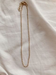 This necklace is 14 inches long and has a 2-inch extender chain so it can be adjusted to be 14-16 inches long! Delicate Chain Metal Long Necklace, Dainty Locket Necklace With Adjustable Chain, Dainty Round Pendant Locket Necklace With Adjustable Chain, Dainty Clavicle Chain Pendant Necklace, Dainty Metal Link Necklaces, Dainty Link Metal Necklaces, Adjustable Metal Drop Necklace With Delicate Chain, Long Clavicle Chain Choker As A Gift, Dainty Metal Link Necklace