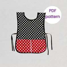 a black and white polka dot bib with red trim