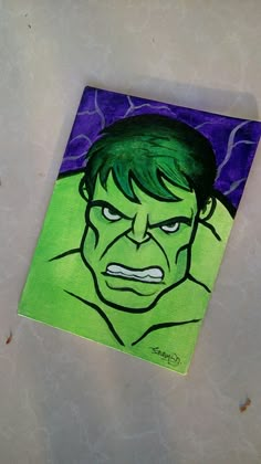 a drawing of the hulk face on a piece of paper with purple and green background