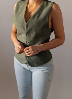 Perfect sage green sleeveless v-neck designer vest by Versace, featuring tortoise buttons down the front with a belt along the back for a tight fit. One side is a cotton like green and the other side is a silky satin. Unisex Vest: Best fits a size Medium, can also fit XS - M. Flat Measures Approx. 24 in Length x 19.5 in Underarm to Underarm x 13 in Shoulder to Shoulder x Sleeveless x Yoke 3.5 in x Waist 19 in (Brand: Versace x Fabric: Feels like Cotton) Model: S, 5ft 4in x Waist: 26 in x Hips: 36 in x Inseam: 30 in x Bust: 34B. Please review policies, shipping & returns on website. Items are authentic vintage and are subject to imperfections. Please enjoy and appreciate this item with its character. Vintage items are FINAL SALE. To view more sets, click here: https://www.etsy.com/shop/Shop Green Waistcoat Outfit, Waistcoat Outfit Women, Green Waistcoat, Waistcoat Outfit, Moschino Dress, Like Green, Vintage Versace, Green Vest, Vest Designs