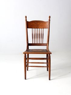 an old wooden chair against a white background