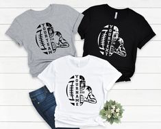 three t - shirts with different designs on them, one is black and the other is white