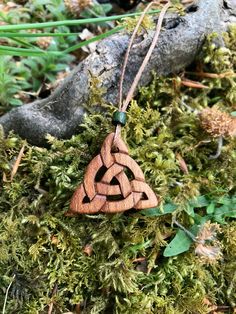 "This beautiful and unique hand-carved Triquetra Celtic necklace will be made for you, or a loved one, in my studio on the West of Ireland. This delicately carved Celtic knot pendant features a piece of Irish Elm wood. Considered one of the sacred trees in the Celtic world, elm has often been associated with Mother and Earth Goddesses. In rural Ireland the elm tree was said to possess magical properties and was considered to be the home of the fairies. Celtic knots date back to the 3rd to 4th ce Adjustable Carved Nature-inspired Jewelry, Brown Carved Spiritual Jewelry, Spiritual Brown Carved Jewelry, Adjustable Carved Nature-inspired Necklaces, Nature-inspired Adjustable Carved Necklaces, Symbolic Carved Brown Jewelry, Brown Carved Nature-inspired Jewelry, Nature-inspired Brown Carved Jewelry, Rural Ireland