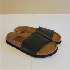 Never Worn Outside. Best For Narrow Feet Since The Strap Is Not Adjustable. More Of A Sophisticated Look For Birkenstocks. Black 36 Sandal. Comfortable Black Footbed Sandals With Cork-bed Midsoles, Black Flat Slides With Cork-bed Midsoles, Black Open Toe Footbed Sandals With Cork-bed Midsoles, Black Flat Heel Footbed Sandals With Cork-bed Midsoles, Casual Black Footbed Sandals With Leather Footbed, Casual Black Leather Footbed Sandals, Black Footbed Sandals With Rubber Sole For Spring, Black Flat Footbed Sandals With Cork-bed Midsoles, Black Footbed Sandals With Leather Sole And Round Toe