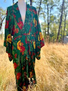 Stunning flowy green robe with red and yellow flowers.  Cut like a traditional Japanese kimono. Looks awesome as your bathrobe, or over a tank top and jeans, or a bikini. Can't really go wrong with it. Length 48" Bust is free size Sleeves 15" long with a 19" drop Label: Bohemia 100% cotton Size M Condition: Excellent Red And Yellow Flowers, Duster Kimono, Floral Duster, Traditional Japanese Kimono, Top And Jeans, Boho Green, Pajama Robe, Red And Yellow, Japanese Kimono