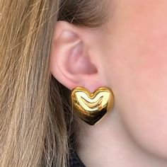 Designed for everyday, these chunky heart stud earrings are a staple for your jewelry box. They shimmer with a high polish finish and feel light as a feather. So comfy and chic, you'll never want to take them off. More Details:- Carefully Handmade- 100% Hypoallergenic- Surgical Stainless Steel- Waterproof & Anti-Tarnish)- Size: H: 27 mm W: 30 mm- Metal Color: Silver, 14k Gold Elegant Chunky Earrings For Gift, Gold Chunky Earrings As Gift, Gold Chunky Earrings For Gift, Modern Gold Heart Earrings, Heart Minimalist, Heart Earrings Silver, Heart Lights, Light Earrings, Earrings Heart