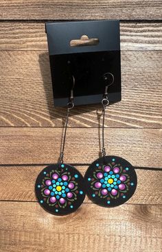 Enjoy these unique hand-painted and hand-wired mandala earrings on wood. Each pair is joyfully created in my studio and includes a touch of repurposed beading.  Hypoallergenic wired hooks. This wearable art is sealed for protection-but please don't submerge them in water! Bohemian Hand Painted Dangle Flower Earrings, Bohemian Multicolor Hand Painted Flower Earrings, Wired Earrings, Mandala Earrings, Dot Art, Rock Crafts, Dot Painting, Dots Art, Wearable Art