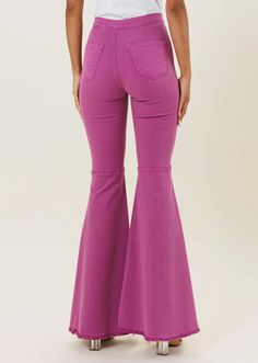 The Purple Color Pop Denim Flares are a trendy and fashionable pair of jeans that are perfect for making a statement. These jeans feature a rise of 10 inches and an inseam of 32 inches, making them a flattering and comfortable fit for most body types. The model in the product images is 5'7" and wearing a size 1. These jeans are made in the United States from a high-quality stretch denim fabric that is soft and easy on the skin. The distressed details add a touch of edge and personality to the je Stretch Denim Fabric, Denim Skirt Women, Flared Pants, Denim Flares, The Purple, Western Outfits, Product Images, Denim Fabric, Flare Pants