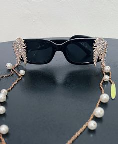 Black Sunglasses  Metal Trim with removable side chains with pearls & iridescent details  Get ready for take off ✨🚀 Metal Trim, Black Sunglasses, Burning Man, Miami Fl, Eyewear Sunglasses, Sunglasses Accessories, Labour Day, Beauty Book, Miami