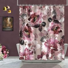 a shower curtain with pink flowers on it