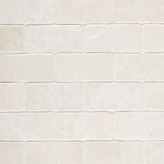 a white brick wall with no mortars on it