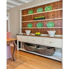 a dining room table with plates and bowls on it