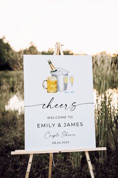 an easel with a sign that says cheers and two mugs of beer on it