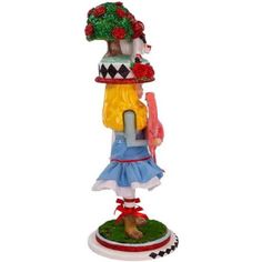 a glass ornament with a girl holding an umbrella on top of her head