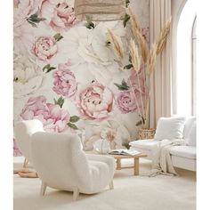 a living room with floral wallpaper and white furniture