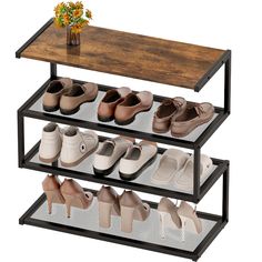 three tiered shoe rack with six pairs of shoes on each shelf and a vase full of flowers