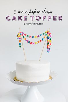 a cake topper with colorful beads on it and the words, how to make paper chain cake toppers