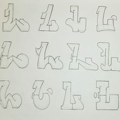 the letters are drawn with black marker on white paper and have been placed in different positions