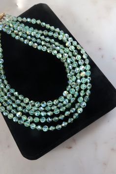 "Vintage 1950s CASTLECLIFF Green Aurora Borealis Crystal Multi Strand Necklace. Length: 16\" Weight: 76.7 grams Marked: Castlecliff Vintage condition! discolored. For more necklaces: https://www.etsy.com/shop/SusVintage?section_id=14148238 Back to the shop: https://www.etsy.com/shop/SusVintage?ref=hdr_shop_menu Don't hesitate to contact me if you have any further questions. Thank you for looking!!" Vintage Single Strand Wedding Necklace, Vintage Single Strand Jewelry For Party, Vintage Evening Single Strand Necklace, Vintage Single Strand Necklace For Evening, Antique Round Beads Jewelry For Party, Statement Necklace Wedding, Green Aurora Borealis, Green Aurora, Unique Brooch