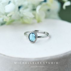 Natural Blue Topaz Adjustable Ring, Sky Blue Gemstone Ring, Vintage Adjustable Sterling Silver Ring Dimension: Adjustable size  Stone 6mm*8mm Please have a look at our store for expanding range of Jewellery. -  Packaging: Each item is packaged in our branded packaging, so your order is ready to be gifted. If the gift item is going straight to the recipient, please make sure leave a comment during checkout so we won't include an invoice.  -  Shipping: All items are ready to be shipped within 2 wo Minimalist Blue Topaz Birthstone Ring, Blue Moonstone Stackable Ring, Blue Stackable Round Moonstone Ring, Blue Round Stackable Moonstone Ring, Blue Aquamarine Solitaire Ring, Stackable Blue Topaz Ring For Promise, Elegant Stackable Blue Topaz Ring, Blue Topaz Stackable Promise Ring, Blue Oval Stackable Rings For Anniversary