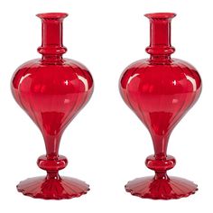 two red vases sitting next to each other