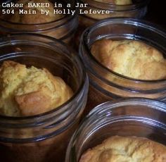 several jars filled with baked goods sitting on a table