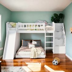 there is a bunk bed with stairs and a slide in the room that leads up to it