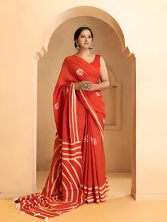 This beautiful handmade Batik print saree is a celebration of traditional Indian craftsmanship. Made from pure cotton, the saree is soft, breathable, and comfortable, perfect for all-day wear. With a length of 6.4 meters, it drapes elegantly, showcasing intricate Batik designs that are both timeless and stylish. The accompanying blouse piece measures 0.90 meters, allowing for a perfect fit. Ideal for both casual and festive occasions, this saree adds a touch of grace and sophistication to any wardrobe. - **Material Pure Cotton for ultimate comfort and breathability. - **Design Traditional Batik print, showcasing intricate handmade designs. - **Saree Length 6.4 meters, providing ample fabric for elegant draping. - **Blouse Piece Includes a 0.90-meter blouse piece, customizable for a perfect Bollywood Cotton Pre-draped Saree For Wedding, Festive Cotton Pre-draped Saree With Block Print, Cotton Pre-draped Saree For Puja During Navratri, Festive Cotton Pre-draped Saree With Pallu, Cotton Pre-draped Saree With Unstitched Blouse For Wedding, Bollywood Style Cotton Pre-draped Saree For Puja, Festive Bollywood Saree With Batik Print, Cotton Pre-draped Saree With Unstitched Blouse For Puja, Cotton Silk Saree With Batik Print For Festivals