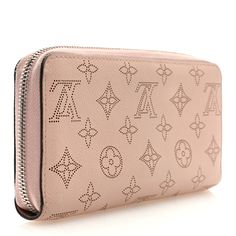 This is an authentic LOUIS VUITTON Mahina Zippy Wallet in Magnolia. This stunning clutch wallet is beautifully crafted of Louis Vuitton monogram perforated leather in pink. The wallet zips open to a matching leather interior lined with card slots, patch pockets, and a zipper pocket. Louis Vuitton Wallet, Perforated Leather, Leather Interior, Clutch Wallet, Authentic Louis Vuitton, Louis Vuitton Monogram, Patch Pocket, Magnolia, Card Slots