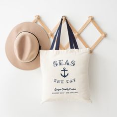 Ahoy! Set sail with our punny nautical tote bag design featuring "seas the day" in navy blue lettering curving around a ship's anchor illustration. Personalize with your family name and/or event type, and the date and destination beneath, to create a unique souvenir for family vacations, trips or cruises. Anchor Illustration, Vacation Tote Bag, Nautical Bridal Showers, Seas The Day, Bridesmaid Tote Bags, Nautical Design, Vine Design, Newlywed Gifts, Gifts For Wedding Party