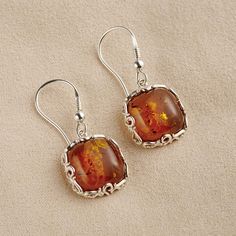 The Fossilized Baltic Amber Earrings - Hammacher Schlemmer Silver And Amber Earrings, Brown Sterling Silver Jewelry For Gifts, Amber Dangle Jewelry With Matching Earrings, Orange Fine Jewelry With Polished Finish, Brown Baltic Amber Jewelry With Polished Finish, Classic Amber Sterling Silver Earrings, Amber Polished Sterling Silver Jewelry, Amber Sterling Silver Jewelry With Polished Finish, Elegant Amber Sterling Silver Earrings