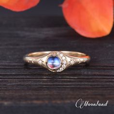 Unique Moonstone Engagement Ring Vintage Yellow Gold Halo Moissanite Star Moon Goddess Ring North Star Ring Celestial Women Anniversary Gift Check the ring set: https://www.etsy.com/listing/1691917919 🌙 Product Details -Main Stone: Top AAA Quality Natural Moonstone, 4mm Round Cabochon Stone -Side Stone: Moissanite, DEF Color, VVS-VS Clarity, 0.04ct Total -Ring Band: 1.8mm -Metal Choice: 925 Sterling Silver/10K/14K/18K Solid Gold (Rose, White, or Yellow) or Pt (Please be aware that rose gold pla Celestial Moonstone Promise Ring, Celestial Moonstone Wedding Ring, Celestial Moonstone Ring For Wedding, Celestial Style Moonstone Promise Ring, Celestial Diamond Moonstone Ring, Celestial Crystal Ring For Anniversary, Celestial Wedding Ring With Bezel Setting, Celestial Moonstone Ring With Moon Phase For Anniversary, Celestial Crescent Moonstone Ring For Anniversary