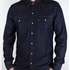 A Must Have Item For Anyone Who Needs That One Item That Can Be Thrown On And Away You Go. The Levis Denim Shirt In A Dark Denim Features Classic Styling Ques With Its Stud Popper Fastening, Twin Chest Pocket Details And Light Coloured Stitching That Contrasts Against The Dark Denim Coloured Shirt. The All Important Levis Red, Tab Logo Appears On The Upper Pocket. Made From 100% Cotton. Fitted Dark Wash Denim Shirt, Fitted Dark Wash Shirt For Summer, Dark Wash Slim Fit Long Sleeve Shirt, Fitted Long Sleeve Levi's Shirt, Fitted Medium Wash Shirt For Fall, Fitted Levi's Button-up Tops, Fitted Levi's Tops In Medium Wash, Classic Fitted Shirt In Medium Wash, Fitted Dark Wash Cotton Shirt