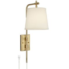 a wall light with a white shade on the side and a plugged in outlet