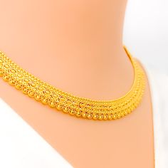 This 22k gold necklace set, weighing 29.8 grams, boasts a reflective and bright artistic design with a radiant yellow gold finish. The 16-inch necklace length, combined with adjustable 1.75-inch links, ensures a perfect fit. Matching 1.1-inch earrings with secure screw-back posts complement the set beautifully. Secured with a hook lock, this set offers a stunning blend of artistry and elegance, making it an ideal choice for those seeking a standout piece for special occasions. PRODUCT DETAILS Gold Purity(karat): 22k Gold Weight(grams): 29.8 Item Finish: Yellow Gold Set Length: 16" Adjustable Links: 1.75" Links Lock Style: Hook Lock Matching Earrings: Included Earring Length: 1.1" Earring Post: Screw Back 22k Gold Necklace Set, 22k Gold Necklace, Bridal Jewelry Necklace, Precious Stones Rings, Diamond Pendant Sets, 16 Inch Necklace, Modern Bracelets, Fancy Necklace, Fancy Rings