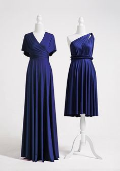 two dresses on mannequins in front of white background, one is wearing a blue dress