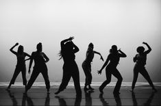 a group of women dancing on top of a dance floor