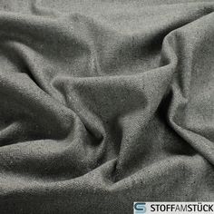 a black and white photo of a gray cloth textured with some sort of stitching