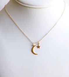 Made of high end gold Vermeil (gold plated sterling silver) and gold filled components, this necklace includes a petite moon and a tiny star. The moon measures 21 x 8 mm and the tiny star only 12 x 6mm. All hang from gold filled chain. The charms are fixed through the links of the chain so they will lay separately instead of clustered. This necklace works beautifully as a mother's necklace with her star child or as a gift to wish someone luck in reaching their dreams. You may select any length f Moon-shaped Yellow Gold Necklaces With Charms, Gold Plated Crescent Charm Necklaces, Yellow Gold Moon Necklaces With Charms, Dainty Crescent Yellow Gold Charm Necklaces, Gold-plated Crescent Charm Necklaces, Yellow Gold Moon-shaped Necklaces With Charms, Dainty Yellow Gold Crescent Charm Necklaces, Gold Plated Crescent Charm Necklace, Gold-plated Crescent Charm Necklace